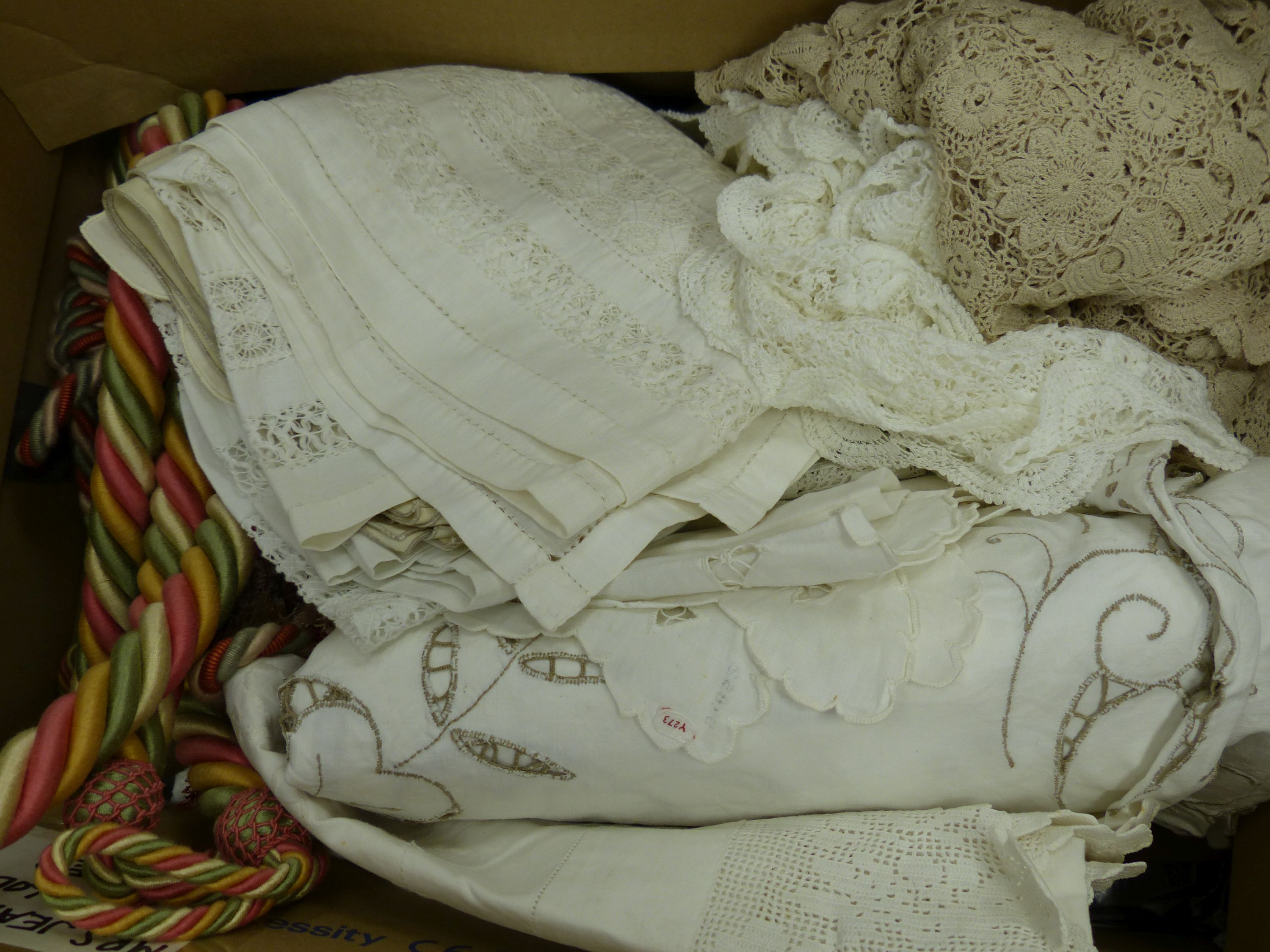 A quantity of table linen and a pair of rope tiebacks